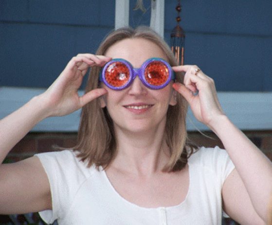 Patricia Wittkopp wearing red and purple fly vision goggles.
